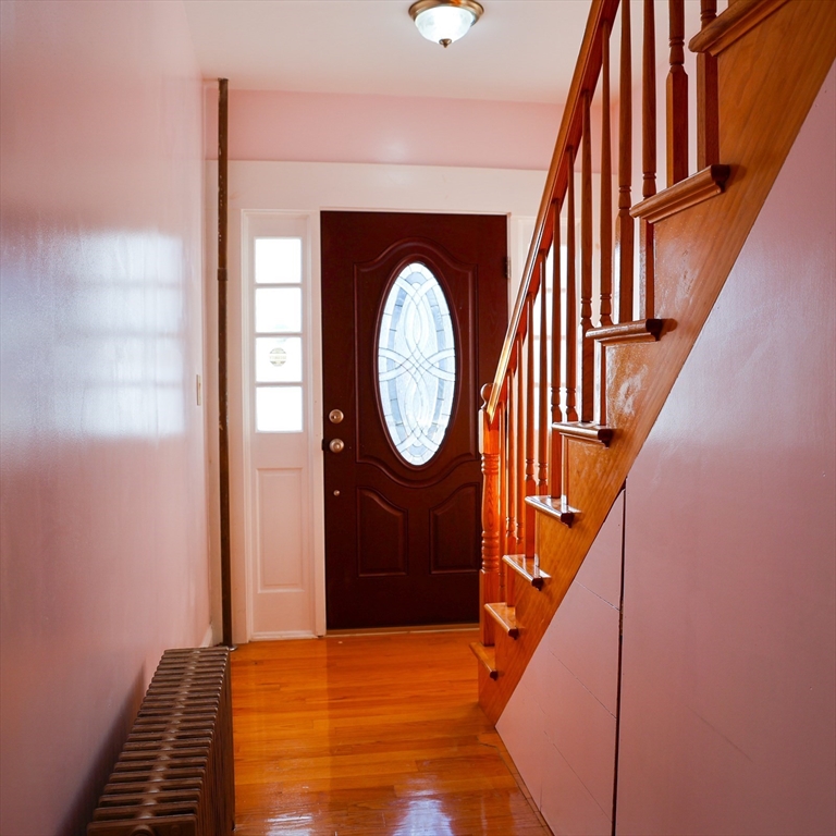 186 Powell Street Lowell, MA 01851 - Photo 10 of 42 a view of stairs with wooden floor