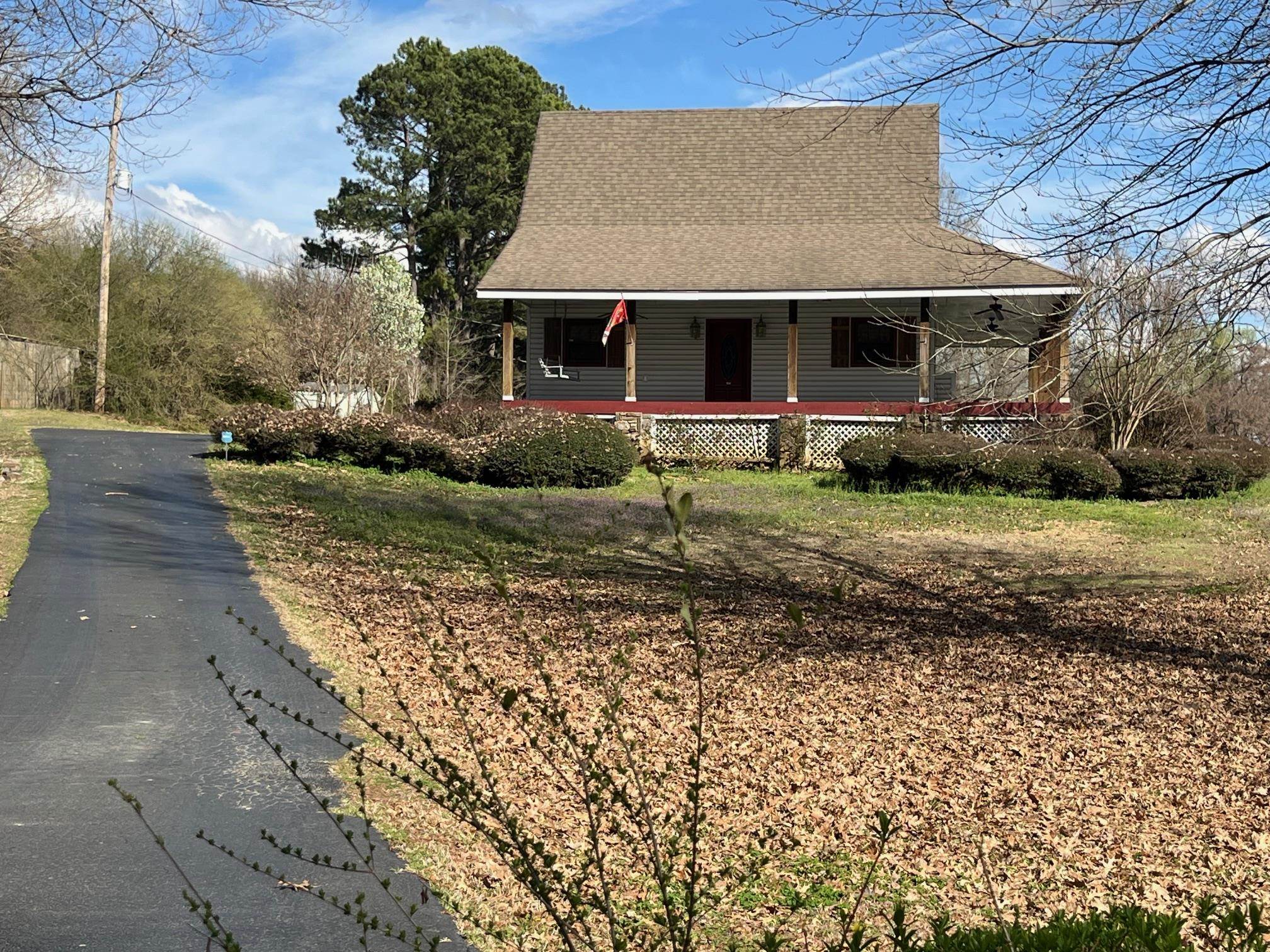 4161 Lucy Road Millington, TN 38053 - Photo 1 of 24 a front view of a house with a garden