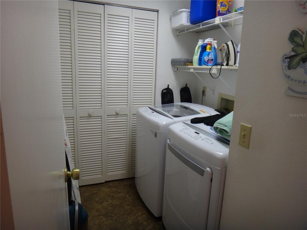 4493 Longmeadow, Unit 76 Sarasota, FL 34235 - Photo 22 of 24 a utility room with dryer and washer