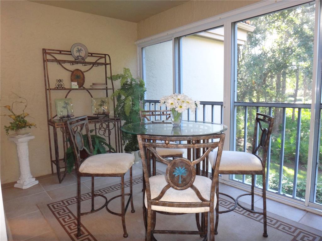 4493 Longmeadow, Unit 76 Sarasota, FL 34235 - Photo 23 of 24 a view of a dining room with furniture window and outside view