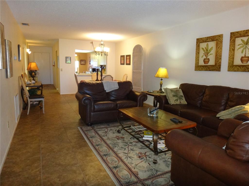 4493 Longmeadow, Unit 76 Sarasota, FL 34235 - Photo 10 of 24 a living room with furniture