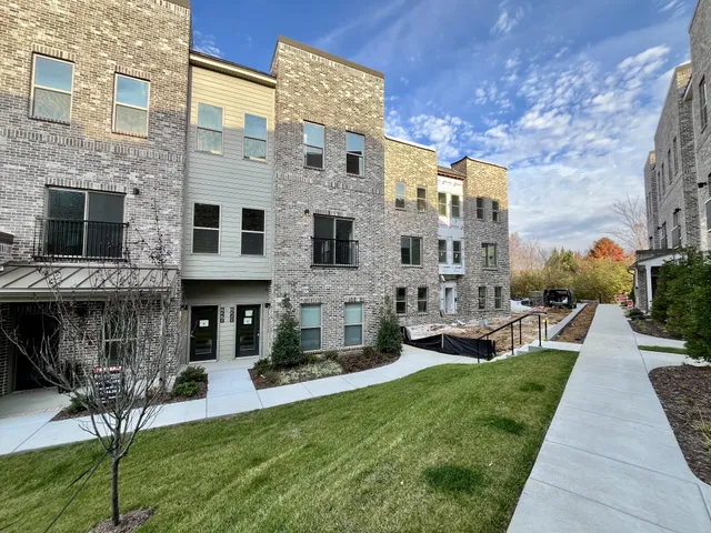a view of a building with a yard