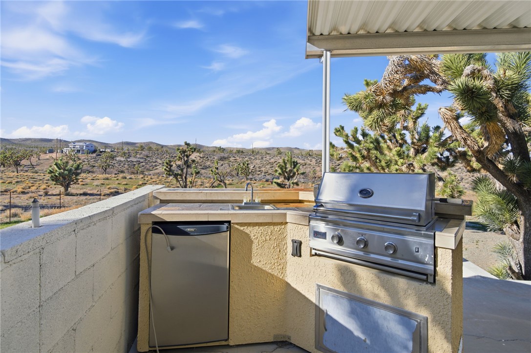 26151 Rainbow Road Meadview, AZ 86444 - Photo 34 of 46 View of patio / terrace featuring exterior kitchen and a mountain view