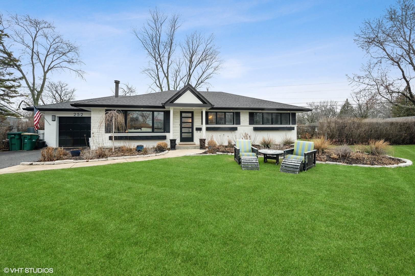 252 Riverside Drive Northfield, IL 60093 - Photo 1 of 23 a front view of house with yard and seating area