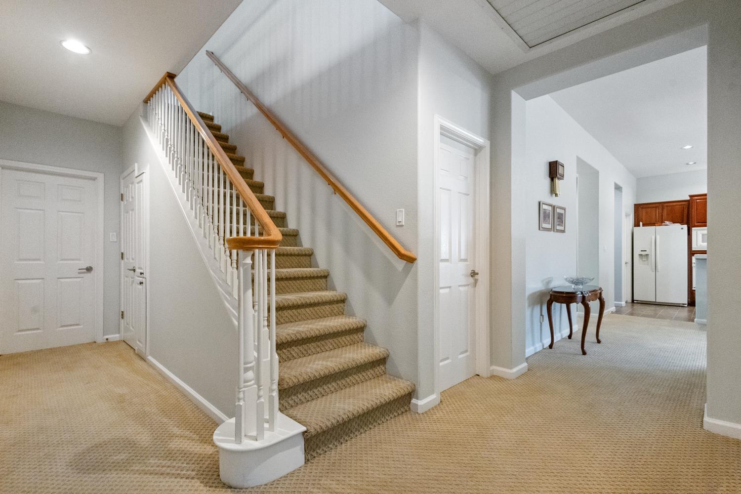 1413 Villette Court Modesto, CA 95356 - Photo 16 of 82 a view of a hallway with entryway staircase and a living room