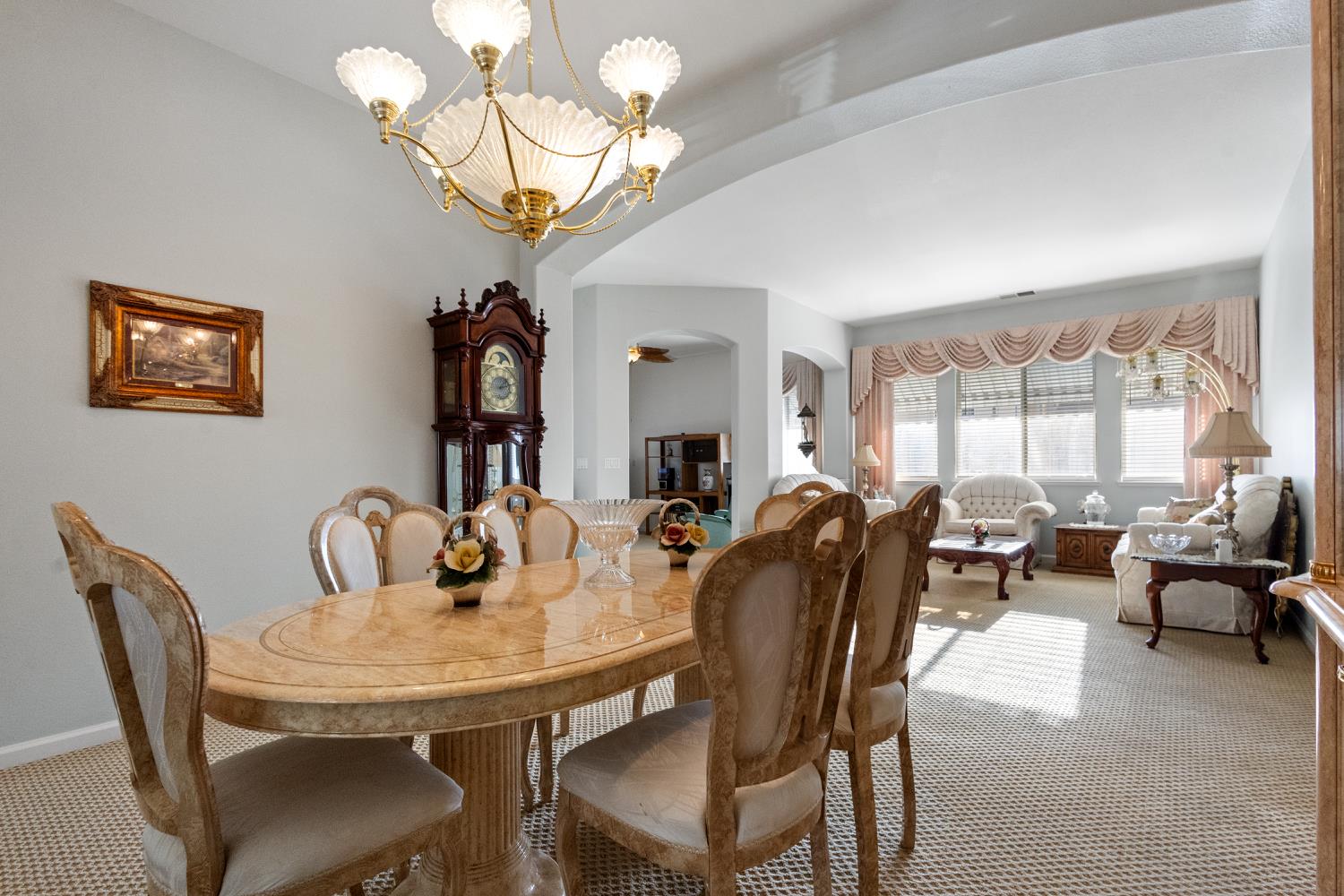 1413 Villette Court Modesto, CA 95356 - Photo 17 of 82 a view of a dining room with furniture wooden floor and chandelier