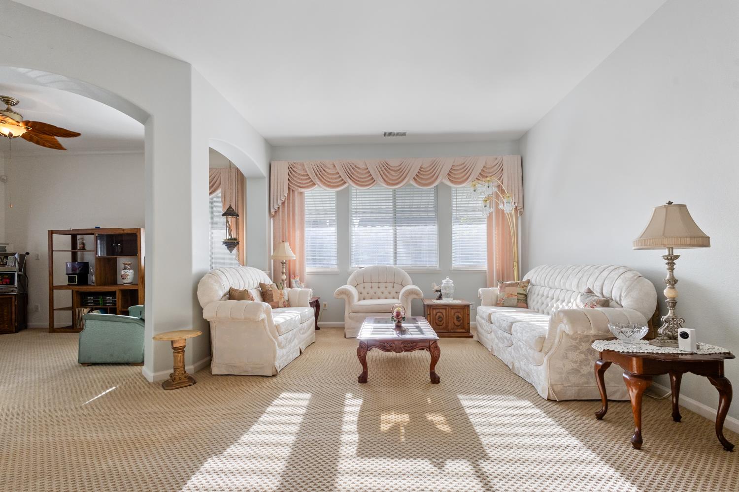 1413 Villette Court Modesto, CA 95356 - Photo 20 of 82 a living room with furniture and a large window