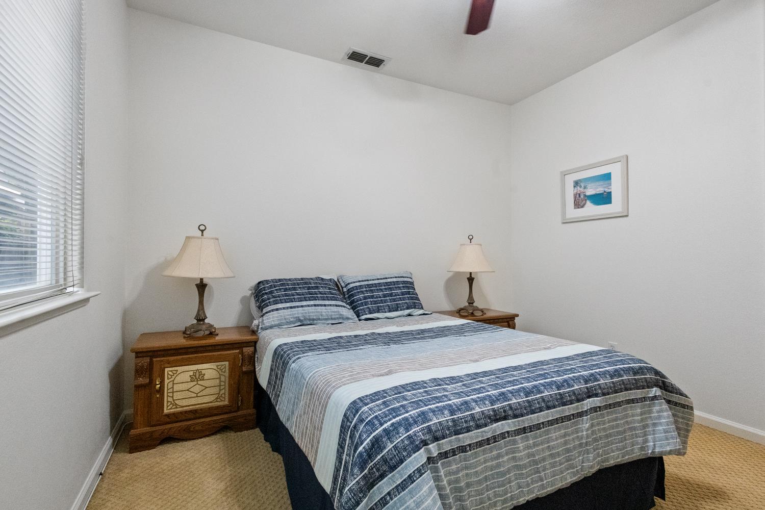 1413 Villette Court Modesto, CA 95356 - Photo 22 of 82 a bedroom with a bed and a window
