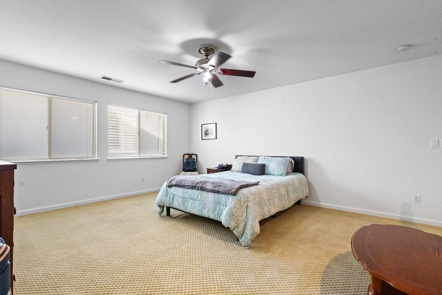 1413 Villette Court Modesto, CA 95356 - Photo 24 of 82 a spacious bedroom with a bed and window