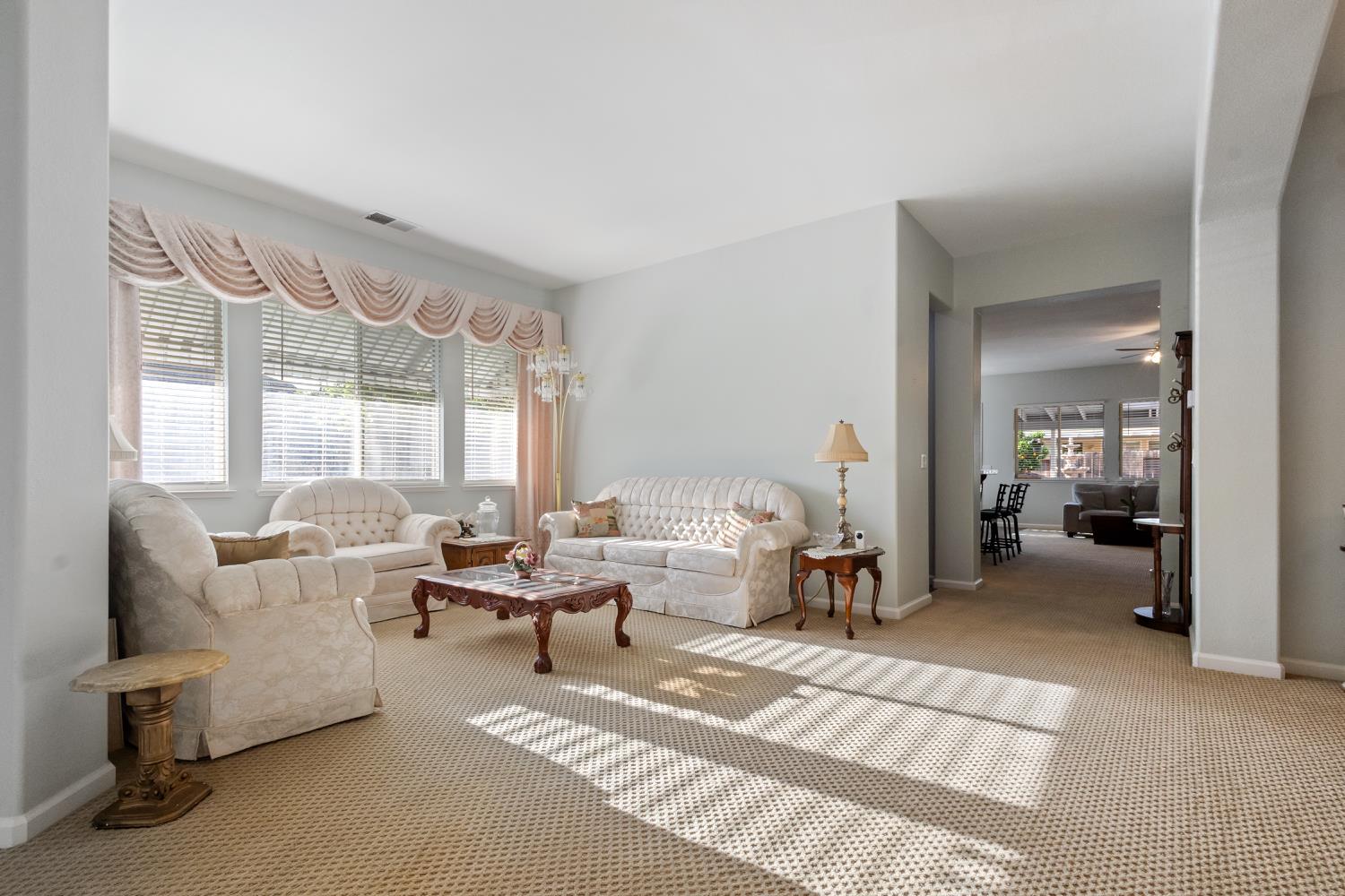 1413 Villette Court Modesto, CA 95356 - Photo 31 of 82 a living room with furniture and a large window