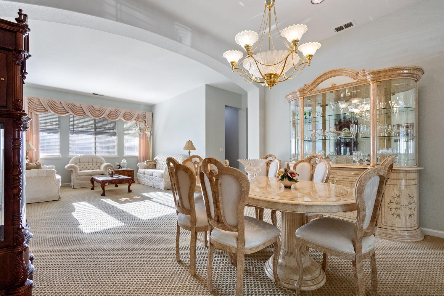 1413 Villette Court Modesto, CA 95356 - Photo 38 of 82 a view of a dining room with furniture wooden floor and chandelier