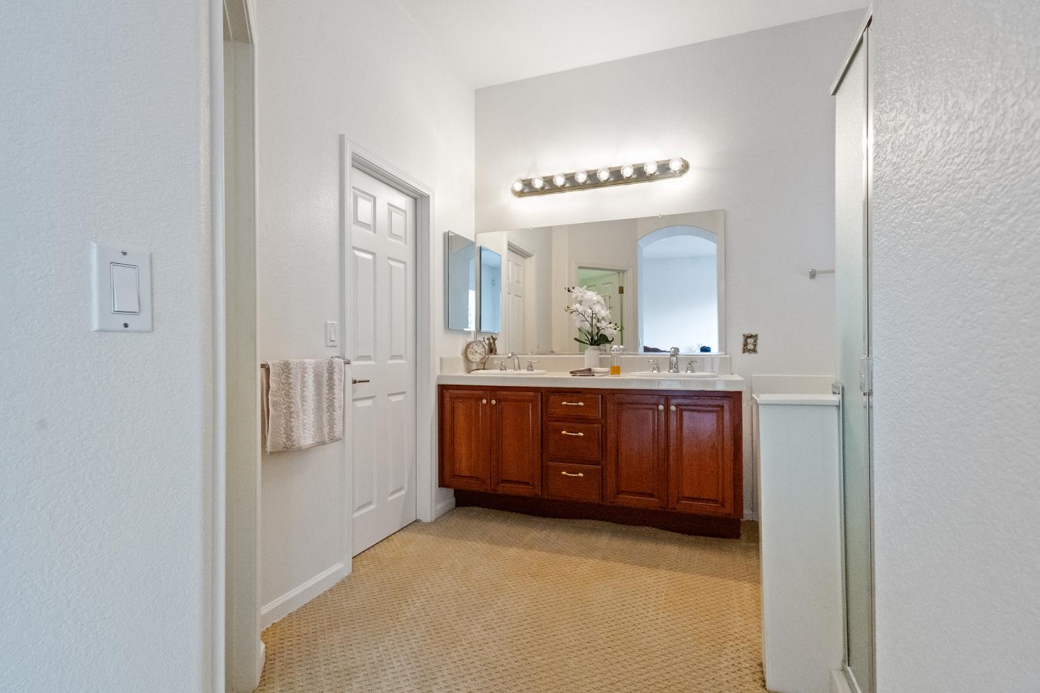 1413 Villette Court Modesto, CA 95356 - Photo 39 of 82 a bathroom with a granite countertop sink and a mirror