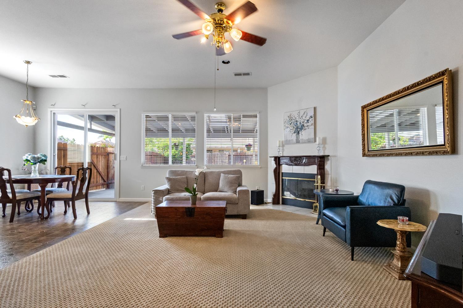 1413 Villette Court Modesto, CA 95356 - Photo 44 of 82 a living room with furniture and a flat screen tv