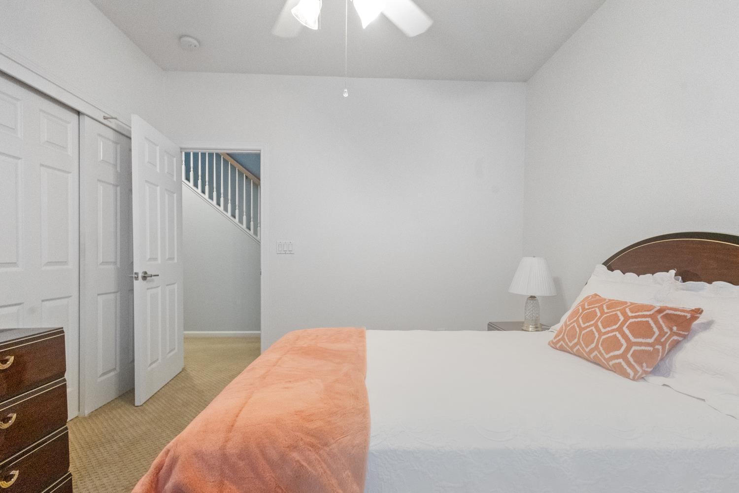 1413 Villette Court Modesto, CA 95356 - Photo 54 of 82 a bedroom with a bed and a lamp