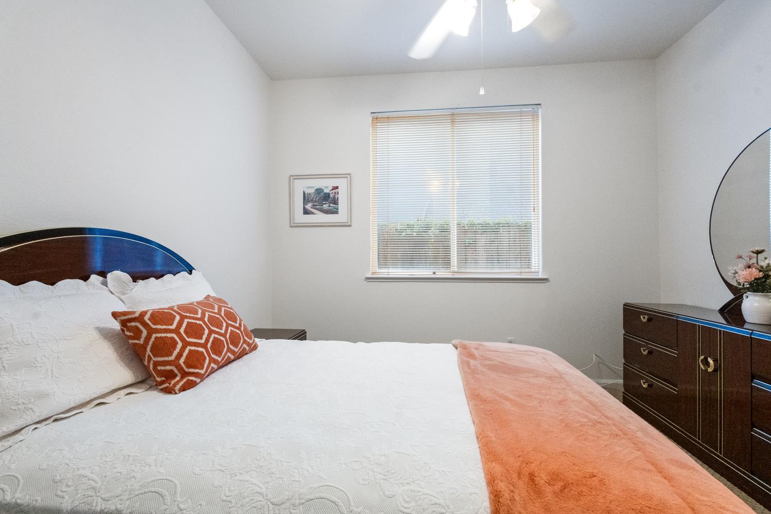 1413 Villette Court Modesto, CA 95356 - Photo 67 of 82 a bedroom with a bed and window