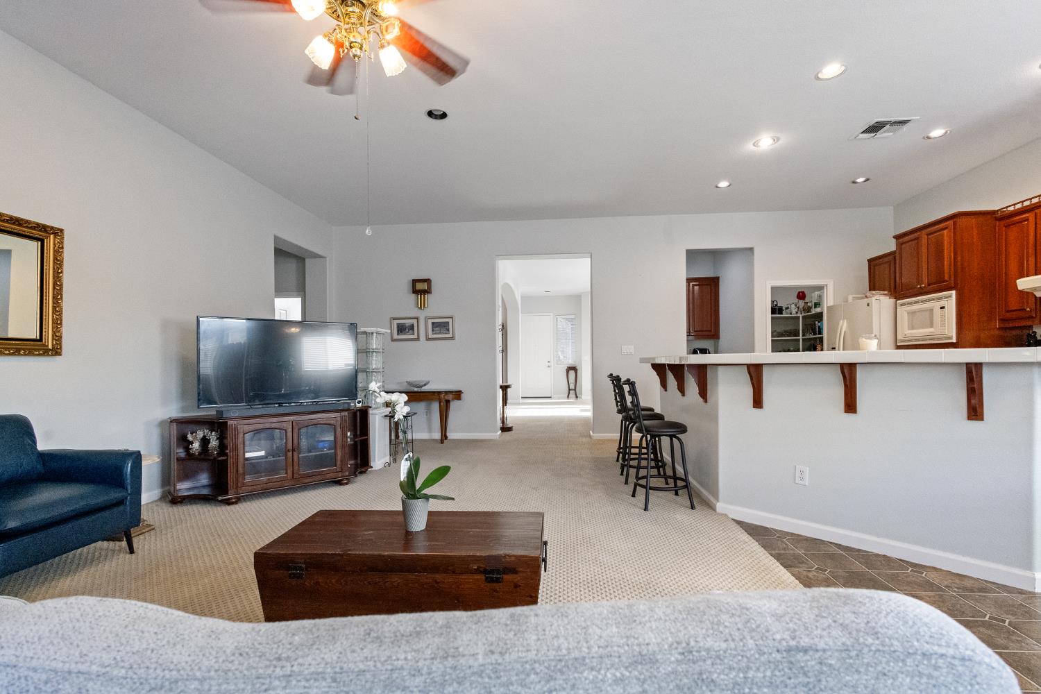 1413 Villette Court Modesto, CA 95356 - Photo 73 of 82 a living room with furniture and a flat screen tv