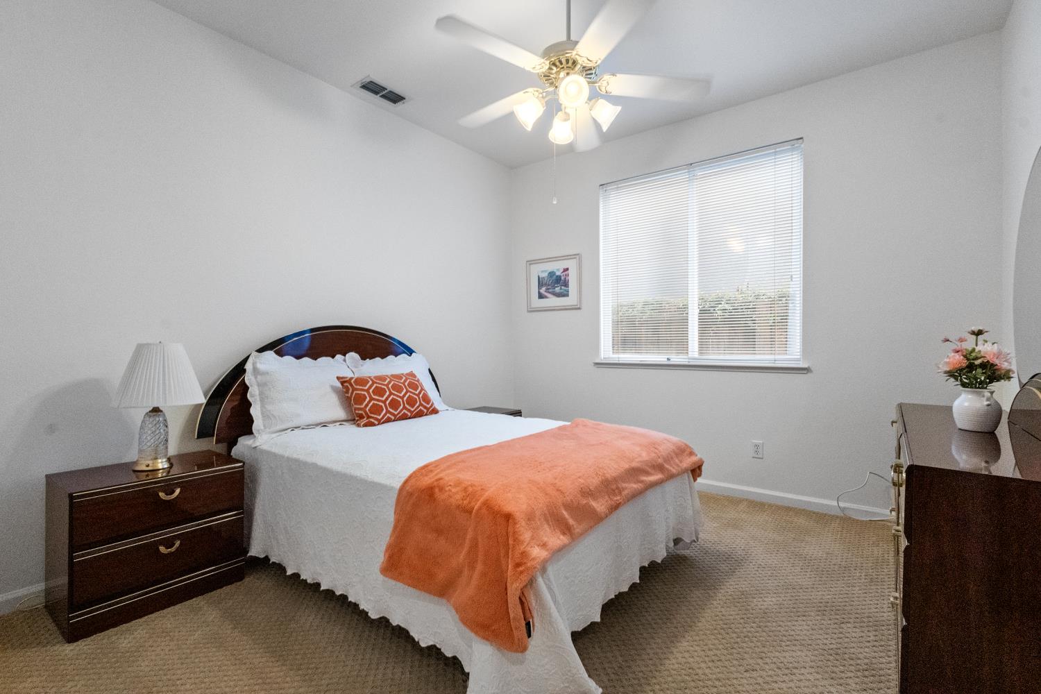 1413 Villette Court Modesto, CA 95356 - Photo 78 of 82 a bedroom with a bed and a chandelier