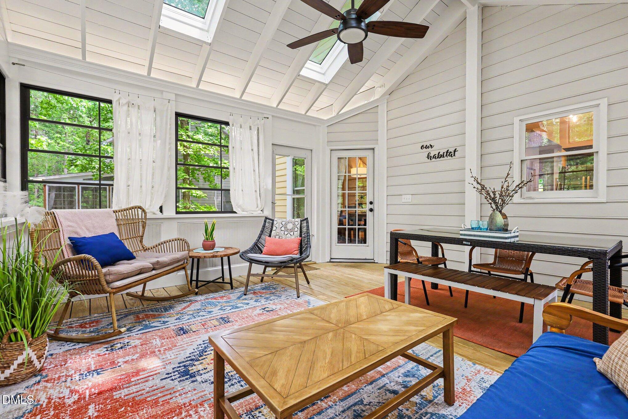 5468 Ingate Way Raleigh, NC 27613 - Photo 21 of 24 a living room with furniture a wooden floor and next to a window