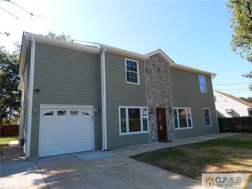 73 Idlewild Road Edison, NJ 08817 - Photo 3 of 21 a view of a house with a yard