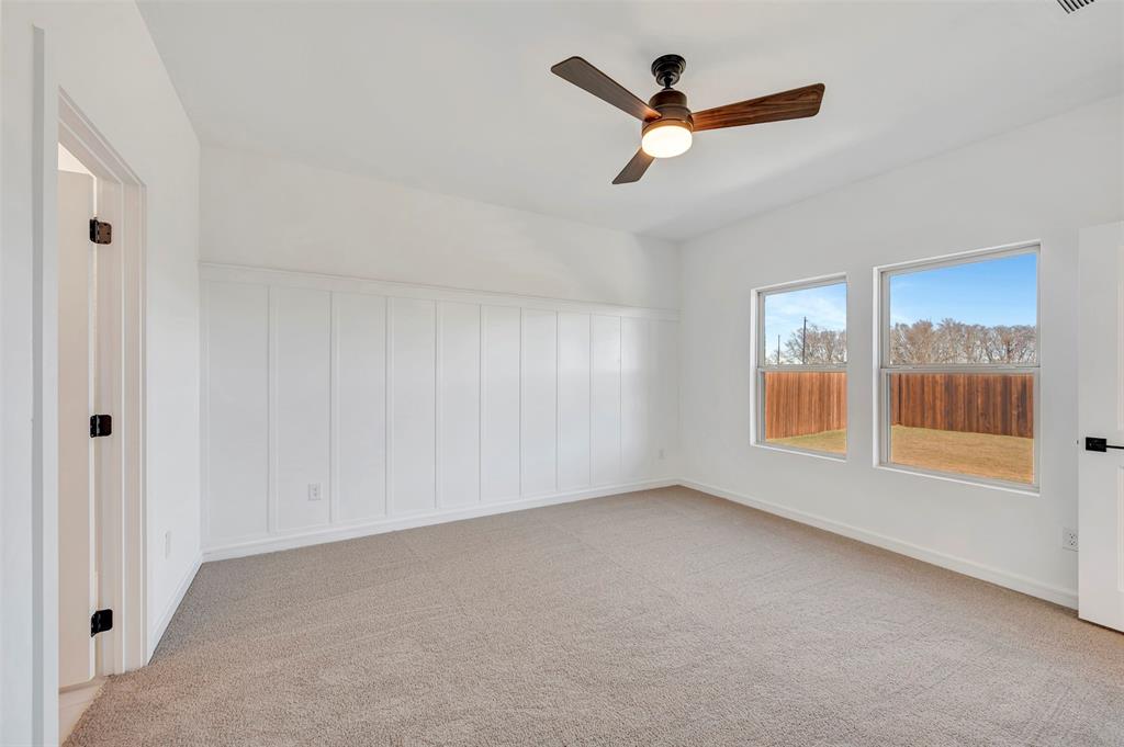 2217 Maple Ridge Drive Van Alstyne, TX 75495 - Photo 20 of 38 wooden floor in an empty room with a window