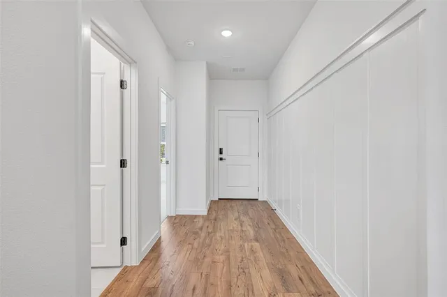 a view of entryway with wooden floor