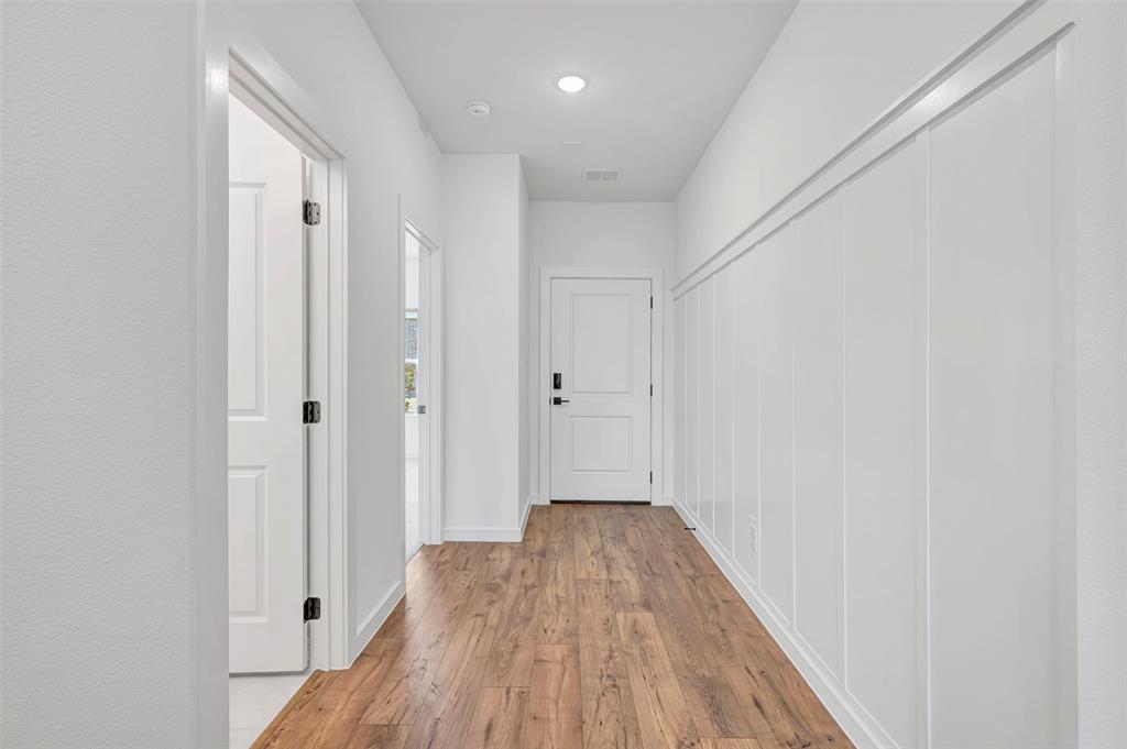 2217 Maple Ridge Drive Van Alstyne, TX 75495 - Photo 4 of 38 a view of a hallway with wooden floor
