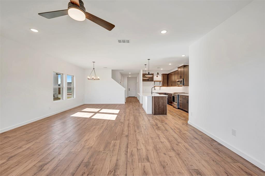 2217 Maple Ridge Drive Van Alstyne, TX 75495 - Photo 10 of 38 a view of a living room with wooden floor