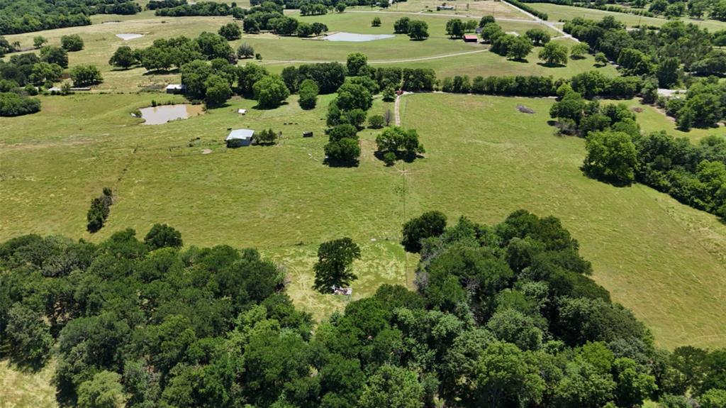 248 Shaffer Road Denison, TX 75021 - Photo 21 of 40 an aerial view of a houses with outdoor space and trees all around