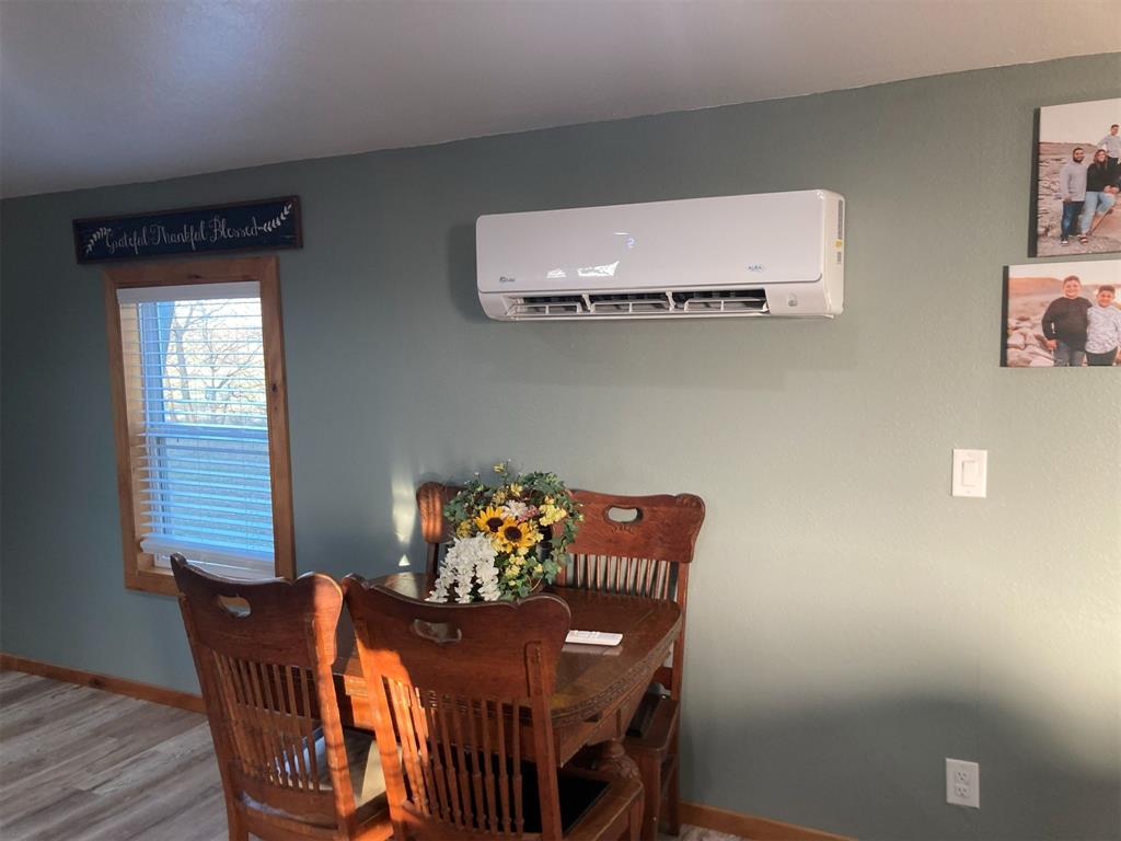248 Shaffer Road Denison, TX 75021 - Photo 8 of 40 a view of a dining room with furniture and wooden floor