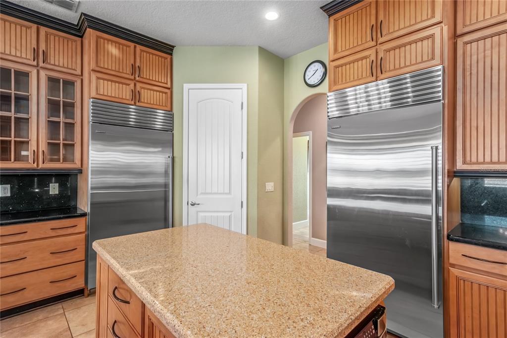 12610 Northwest Gainesville Road Reddick, FL 32686 - Photo 34 of 90 a kitchen with stainless steel appliances granite countertop a refrigerator and a stove