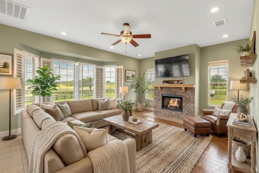 12610 Northwest Gainesville Road Reddick, FL 32686 - Photo 37 of 90 a living room with furniture fireplace and a large window