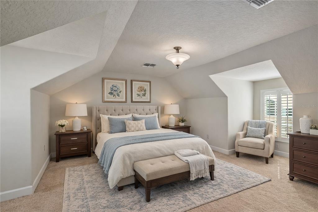 12610 Northwest Gainesville Road Reddick, FL 32686 - Photo 52 of 90 a bedroom with bed and a couch