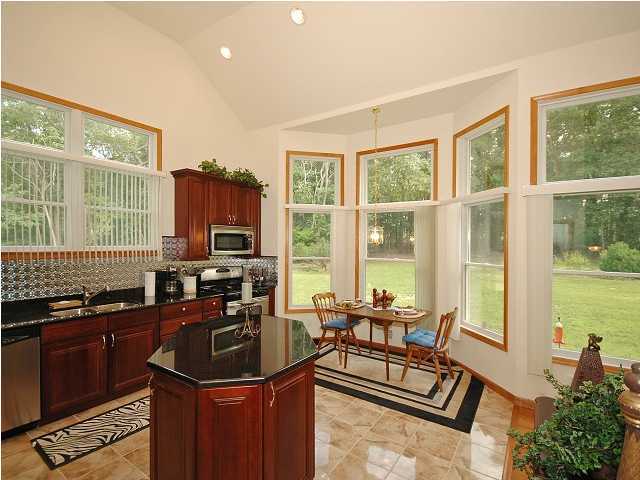 78 Ely Harmony Road Freehold, NJ 07728 - Photo 3 of 3 a living room with furniture a flat screen tv and large windows