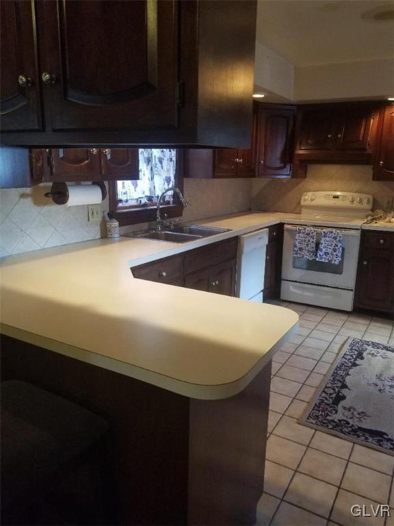 2227 Main Street Northampton, PA 18067 - Photo 7 of 31 a kitchen with stainless steel appliances a sink dishwasher a stove a microwave oven and cabinets