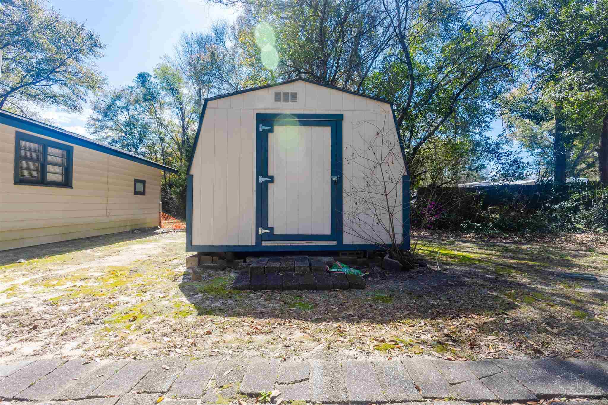 10001 Chemstrand Road Pensacola, FL 32514 - Photo 11 of 18 a front view of a house with garden