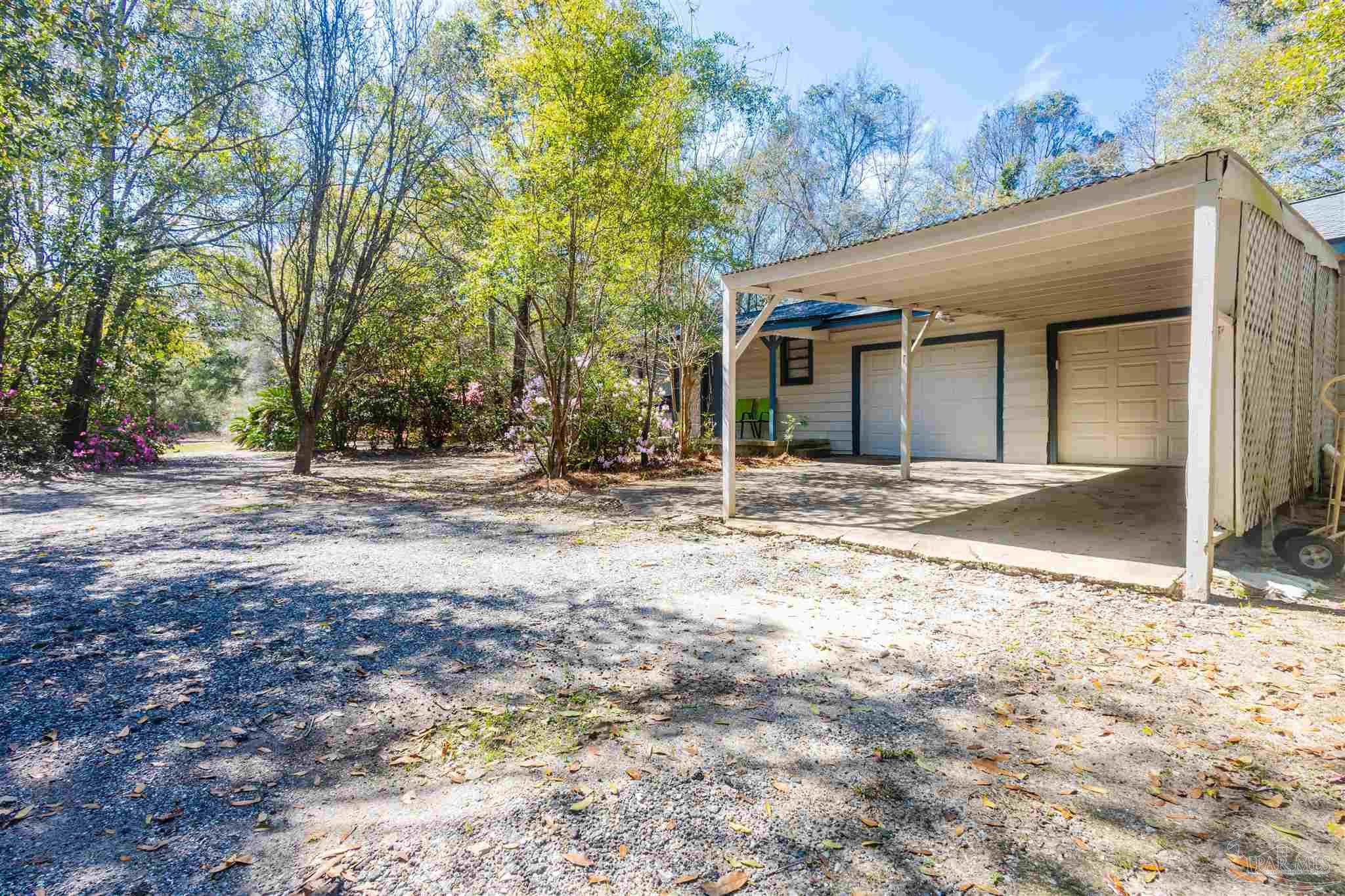 10001 Chemstrand Road Pensacola, FL 32514 - Photo 2 of 18 a view of a house with a yard