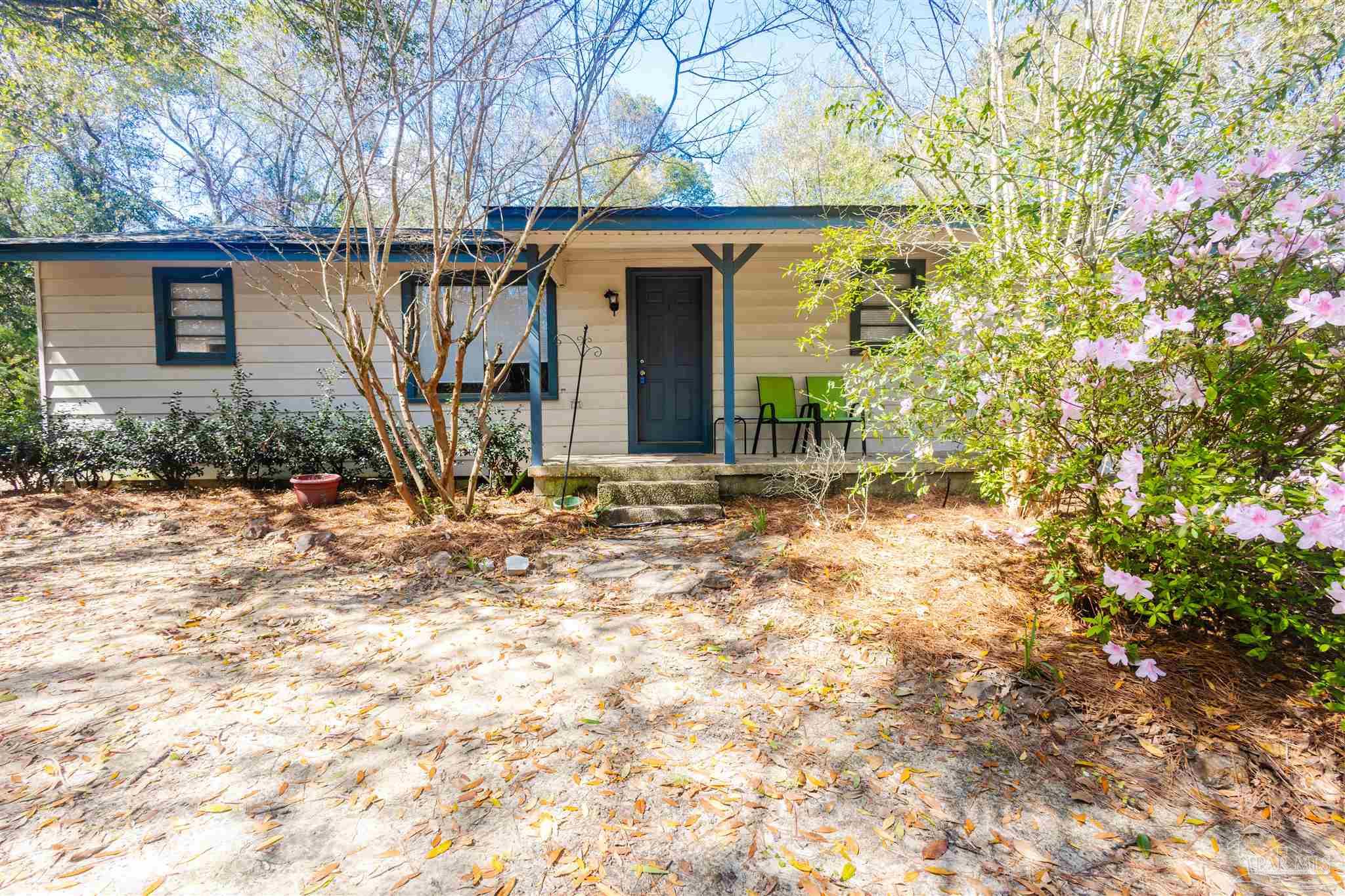 10001 Chemstrand Road Pensacola, FL 32514 - Photo 4 of 18 a view of a house with a yard