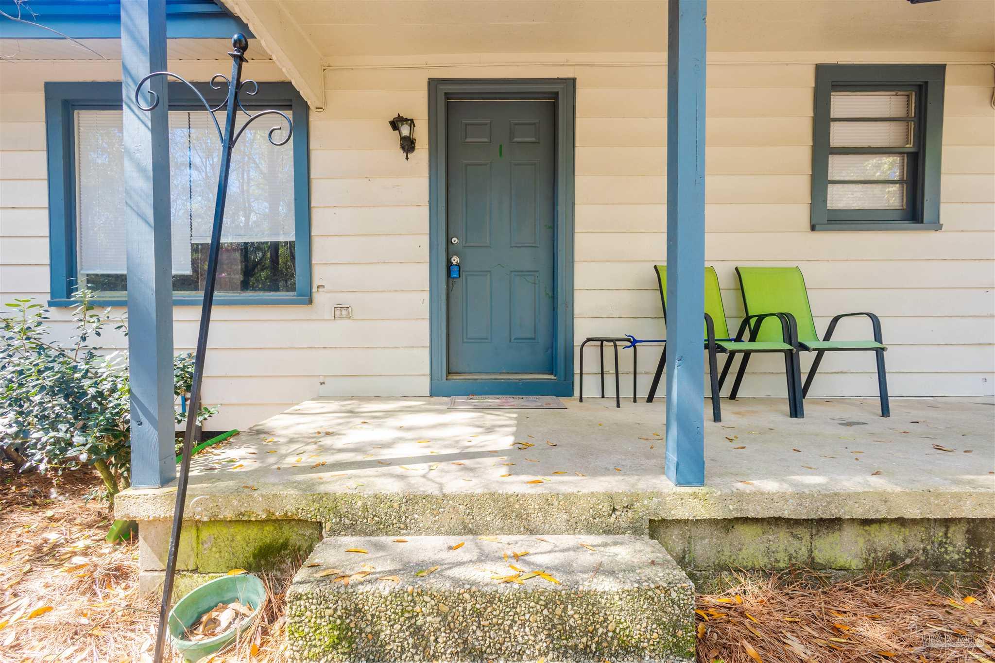 10001 Chemstrand Road Pensacola, FL 32514 - Photo 6 of 18 a bathroom with a granite countertop sink and a mirror