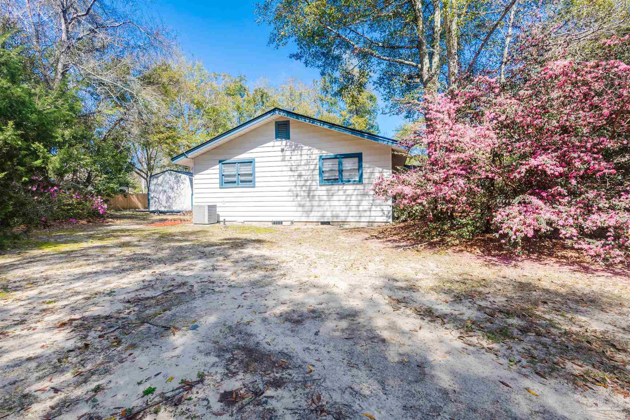 10001 Chemstrand Road Pensacola, FL 32514 - Photo 8 of 18 a view of a house with a yard