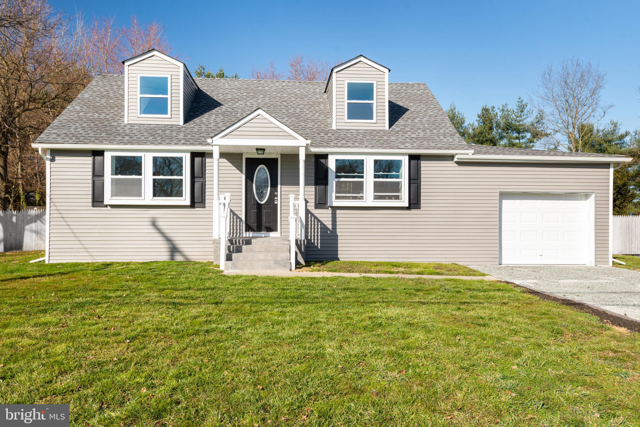 129 Marlton Road Pilesgrove, NJ 08098 - Photo 1 of 27 a front view of a house with a yard