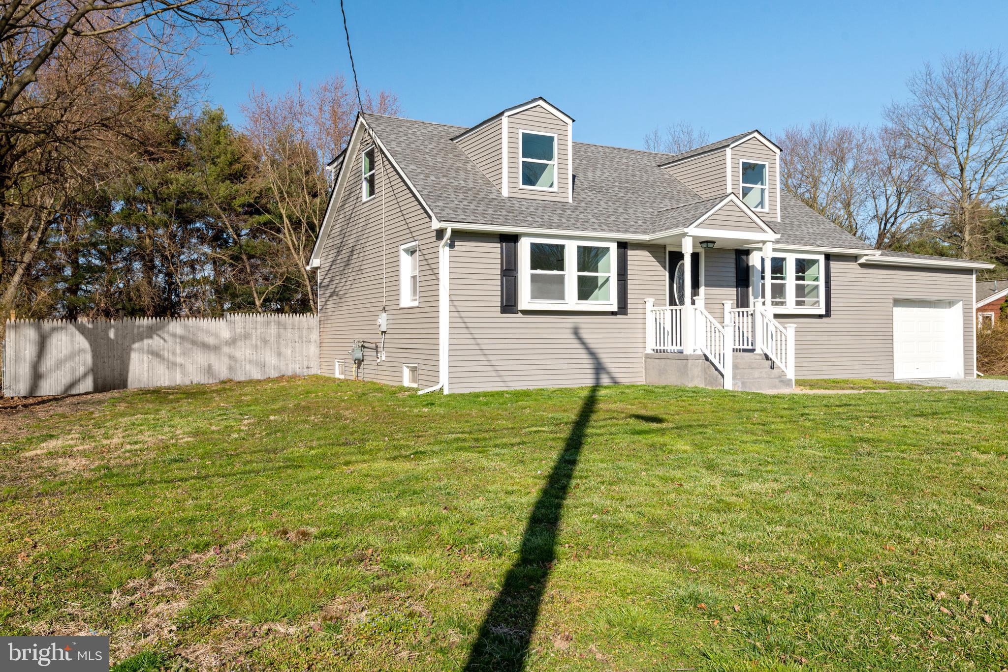 129 Marlton Road Pilesgrove, NJ 08098 - Photo 2 of 27 a front view of a house with garden