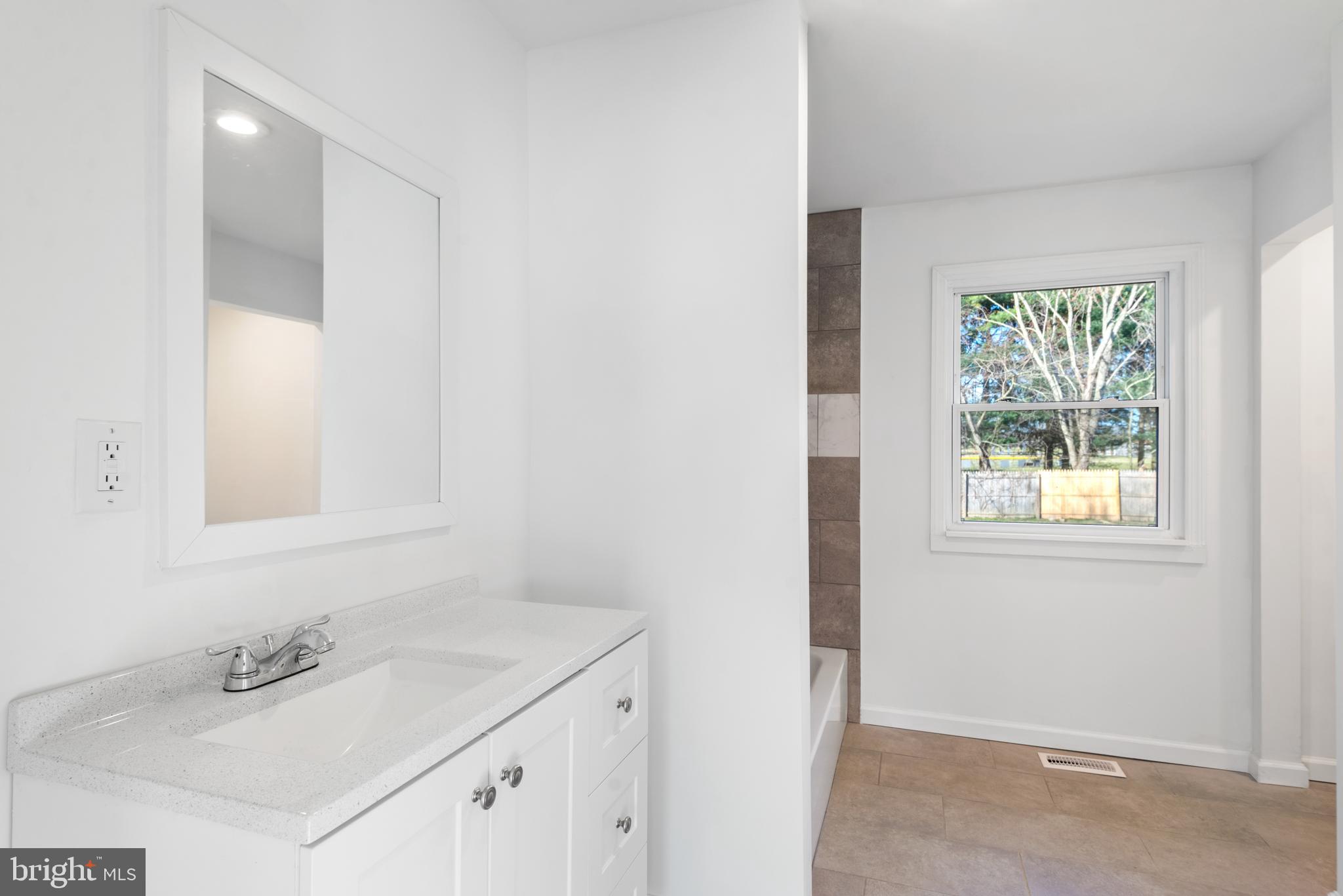 129 Marlton Road Pilesgrove, NJ 08098 - Photo 13 of 27 a bathroom with a sink and a mirror