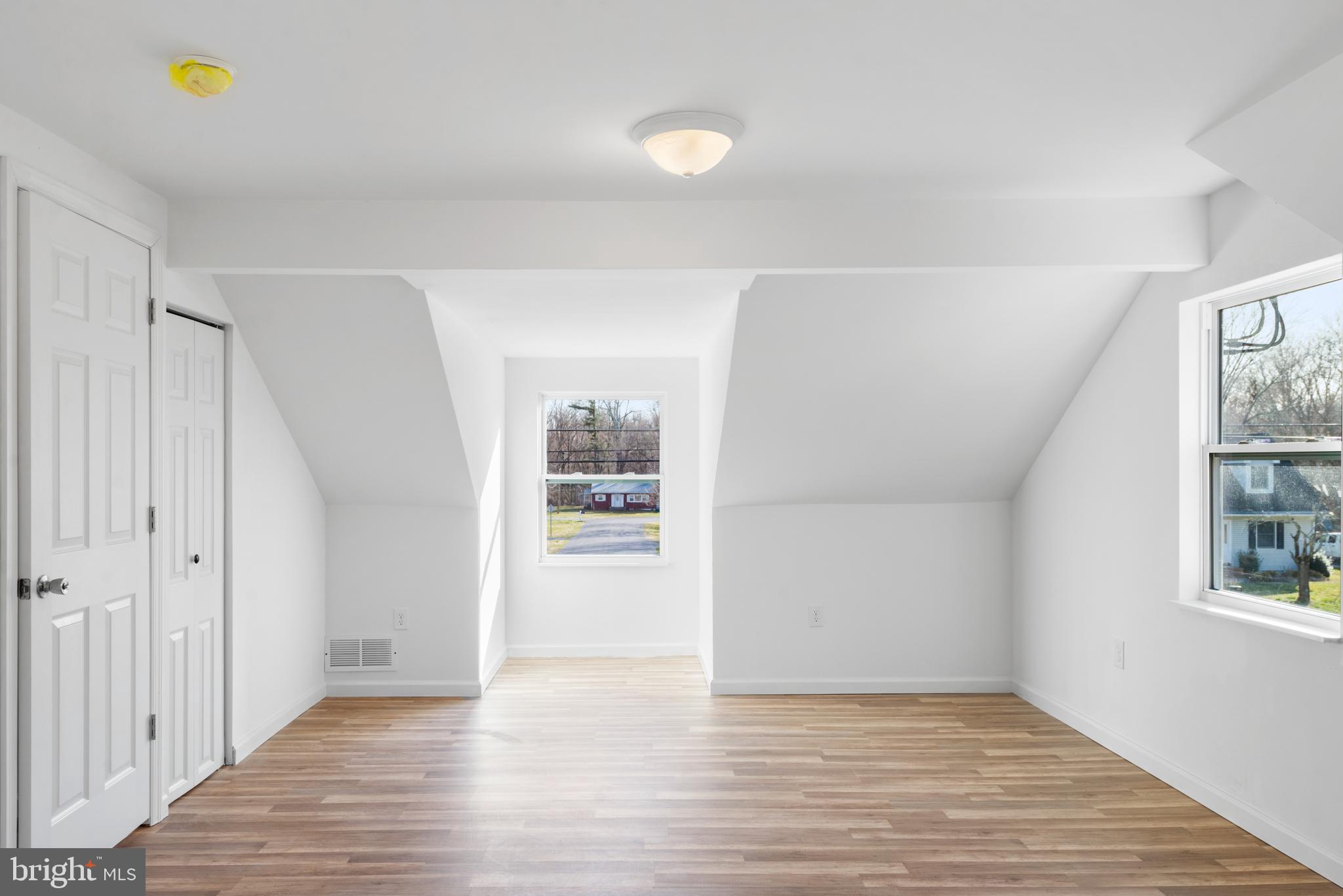 129 Marlton Road Pilesgrove, NJ 08098 - Photo 18 of 27 a view of a room with wooden floor and window