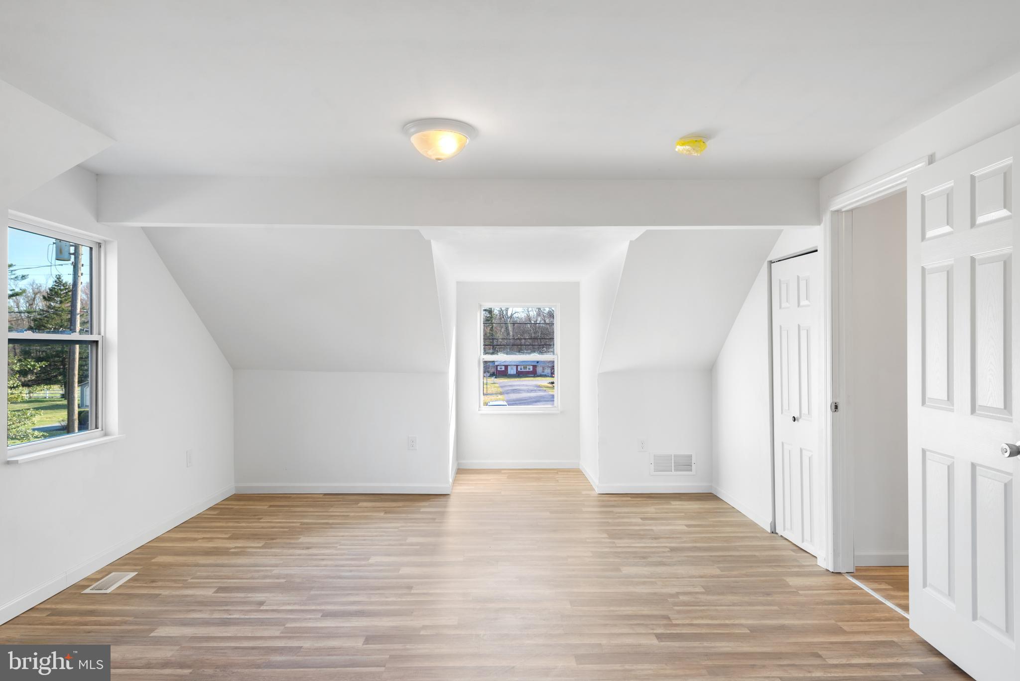 129 Marlton Road Pilesgrove, NJ 08098 - Photo 19 of 27 a view of an empty room with wooden floor and a window