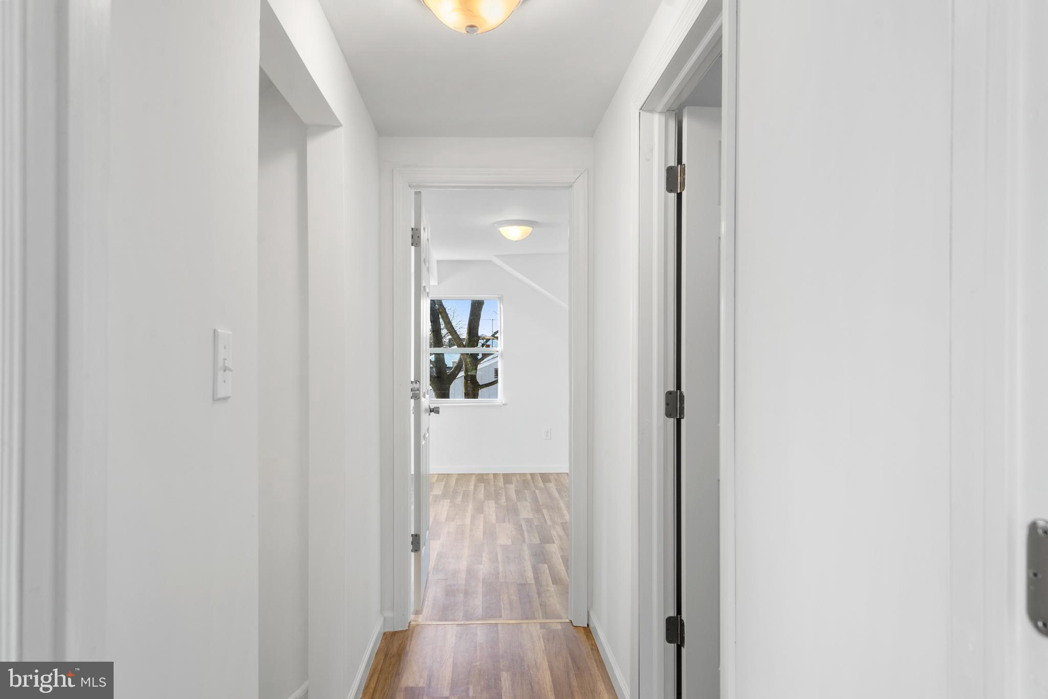 129 Marlton Road Pilesgrove, NJ 08098 - Photo 20 of 27 a view of a hallway with wooden floor