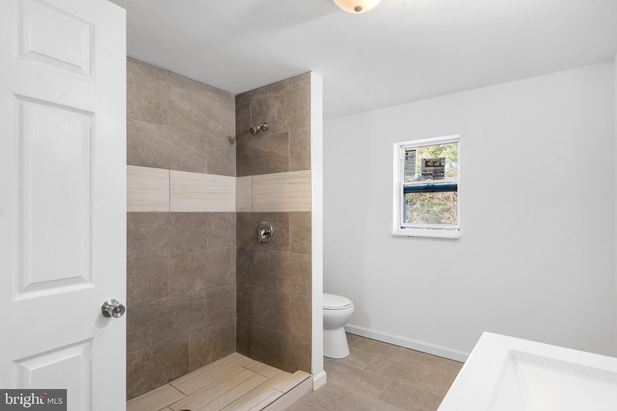 129 Marlton Road Pilesgrove, NJ 08098 - Photo 22 of 27 a bathroom with a toilet and a shower