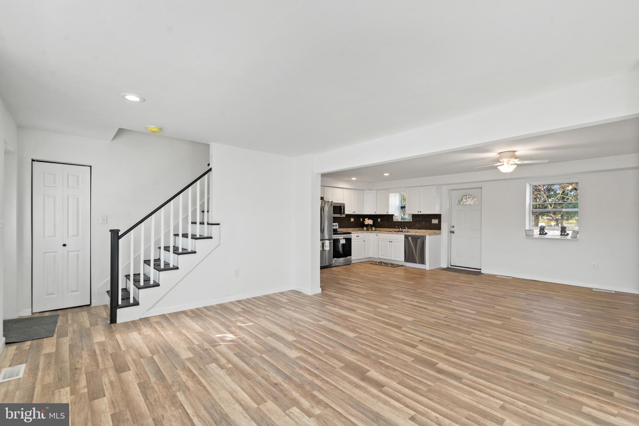 129 Marlton Road Pilesgrove, NJ 08098 - Photo 6 of 27 a view of kitchen and hall with wooden floor