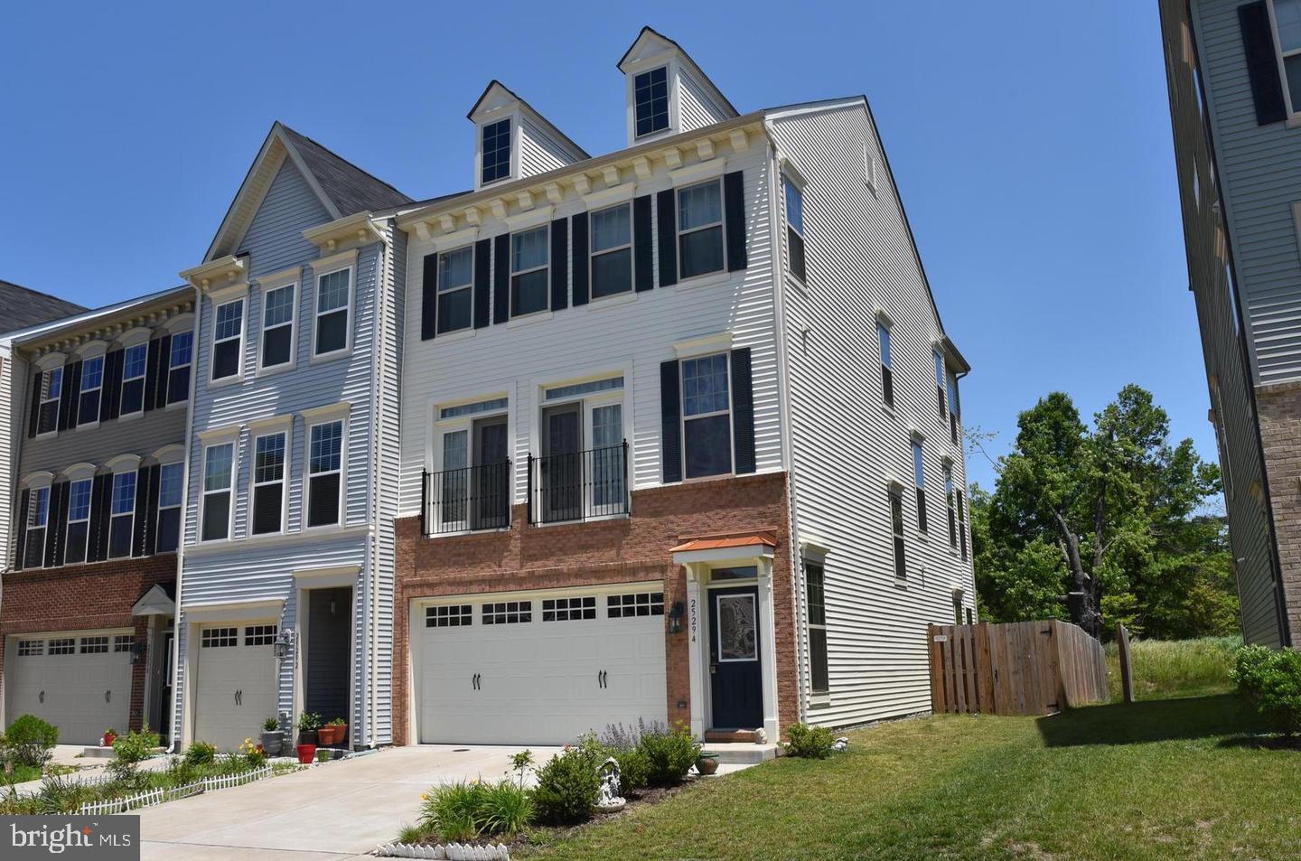 25294 Arrowroot Terrace Chantilly, VA 20152 - Photo 2 of 3 a front view of a house with a yard