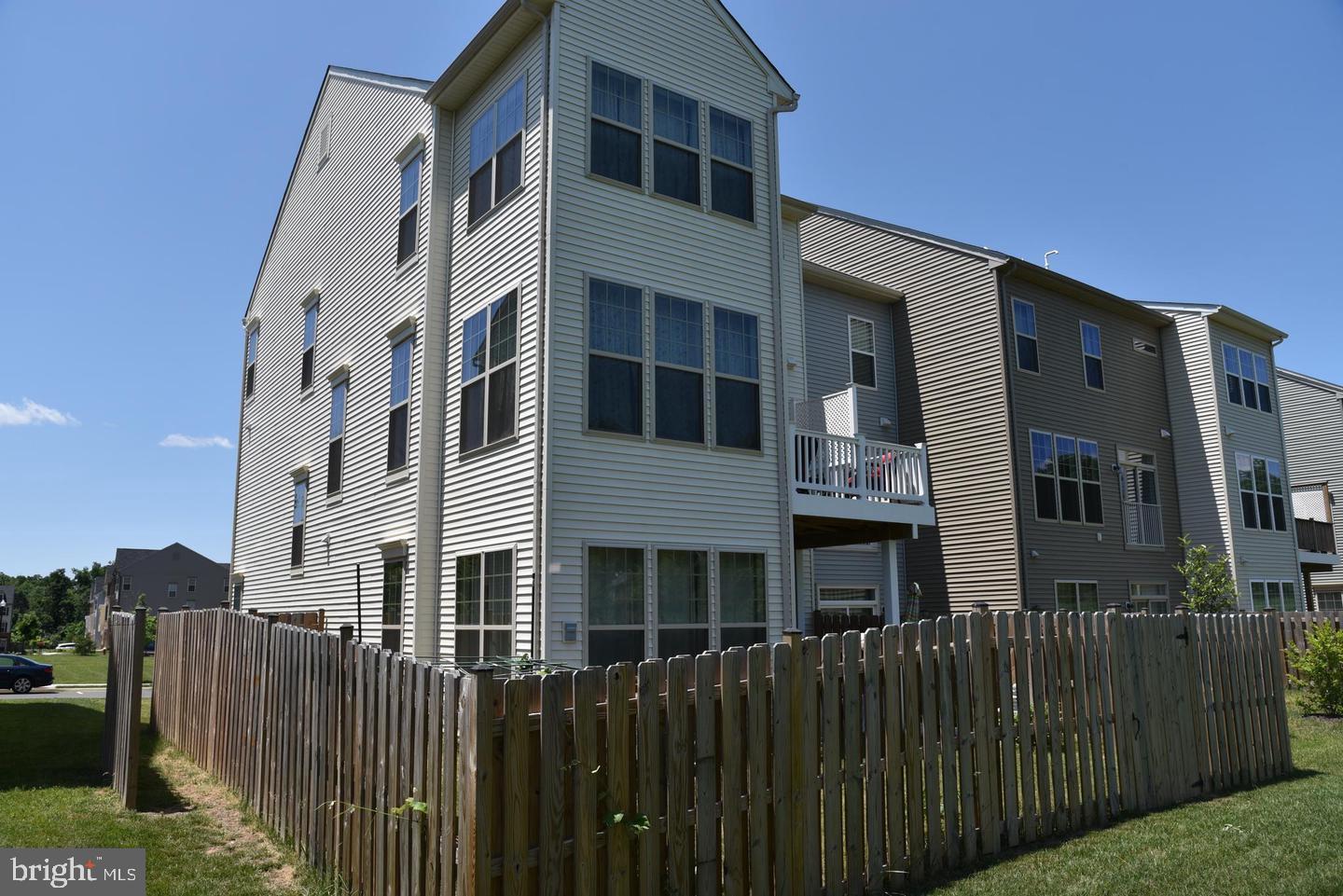 25294 Arrowroot Terrace Chantilly, VA 20152 - Photo 3 of 3 a front view of a house with a fence
