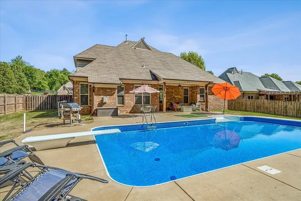 a view of a house with swimming pool
